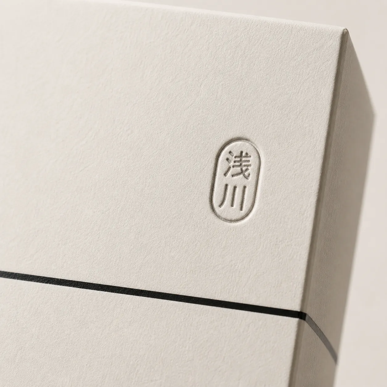 Debossing detail — the Asakawa stamp on gift box