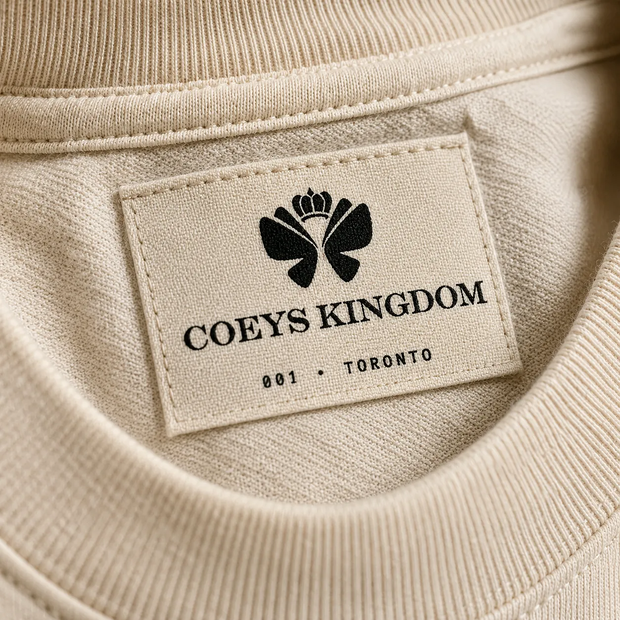 Coeys Kingdom 棉质内标特写——皇冠 logo + 001 · TORONTO 编号